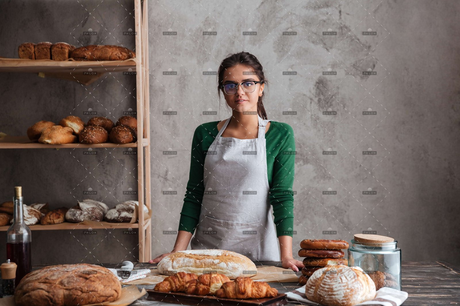 demo-attachment-650-op_happy-young-lady-baker-standing-at-bakery-near-PK9JSB5